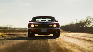 Sleek Ford Mustang Mach 1 In Action Wallpaper