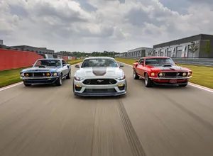 Sleek Ford Mustang Mach 1 On The Road Wallpaper