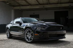 Sleek Ford Mustang Roush Showcased Under Dramatic Lighting Wallpaper