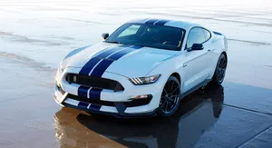 Sleek Ford Mustang Shelby Gt350 Showcased On Open Road Wallpaper