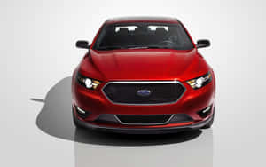 Sleek Ford Taurus On An Open Road Wallpaper