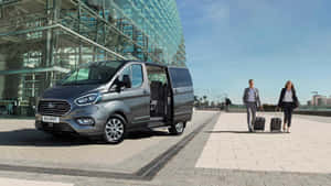 Sleek Ford Transit Parked In Urban Setting Wallpaper