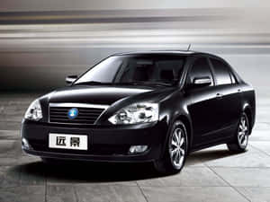 Sleek Geely Sedan In Motion Wallpaper