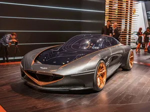 Sleek Genesis Essentia Sport Concept Car In Motion Wallpaper