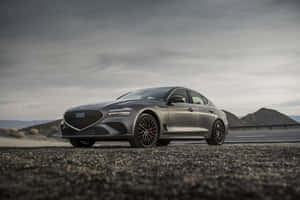 Sleek Genesis G70 Cruising On The Open Road Wallpaper