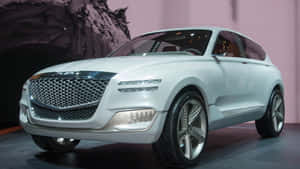 Sleek Genesis Gv80 Luxury Suv On The Road Wallpaper