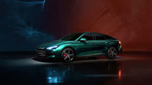 Sleek Green Sedan Under Lights Wallpaper