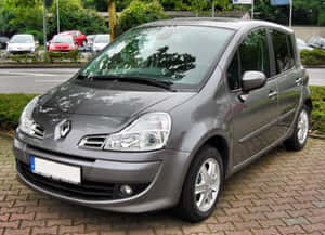 Sleek Grey Renault Modus On A Scenic Road Wallpaper