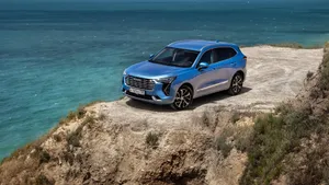 Sleek Haval Suv Cruising On A Scenic Road Wallpaper