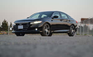 Sleek Honda Accord Cruising On A Scenic Highway Wallpaper