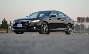 Sleek Honda Accord Cruising On A Scenic Highway Wallpaper