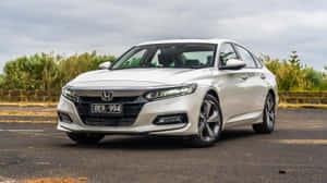 Sleek Honda Accord On A Picturesque Countryside Road Wallpaper