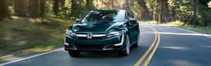 Sleek Honda Clarity Cruising On The Highway Wallpaper
