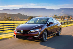 Sleek Honda Clarity In A Scenic Environment Wallpaper