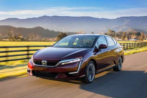 Sleek Honda Clarity In A Scenic Environment Wallpaper