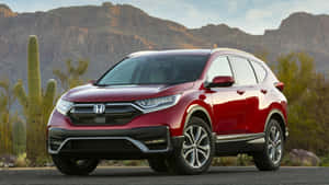 Sleek Honda Cr-v Cruising In The City Wallpaper