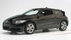 Sleek Honda Cr-z Hybrid Coupe In Action Wallpaper