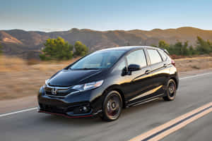 Sleek Honda Fit: Compact Elegance And Economy Wallpaper