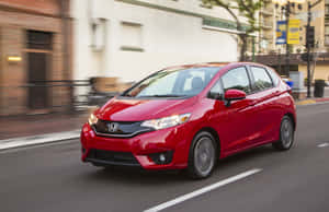 Sleek Honda Fit In An Elegant Setting Wallpaper