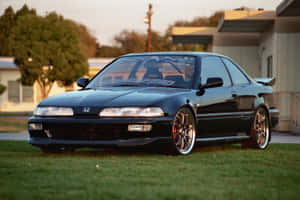 Sleek Honda Integra In Stunning Outdoor Setting Wallpaper