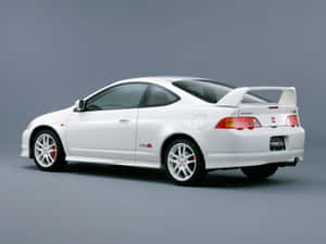 Sleek Honda Integra On The Road Wallpaper