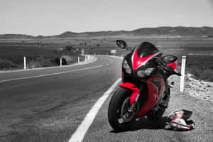 Sleek Honda Motorcycle Showcasing Ultimate Speed & Elegance Wallpaper
