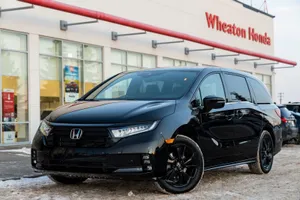 Sleek Honda Odyssey Minivan In Motion Wallpaper