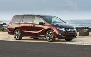 Sleek Honda Odyssey Parked By The Riverside Wallpaper