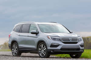 Sleek Honda Pilot On The Road Wallpaper