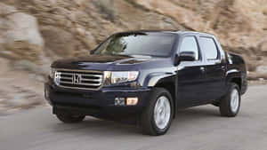 Sleek Honda Ridgeline In Scenic Landscape Wallpaper