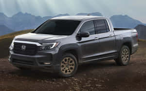 Sleek Honda Ridgeline In Scenic Landscape Wallpaper