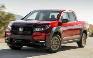 Sleek Honda Ridgeline On Scenic Road Wallpaper