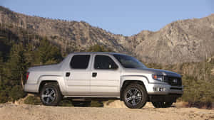 Sleek Honda Ridgeline On Scenic Road Wallpaper