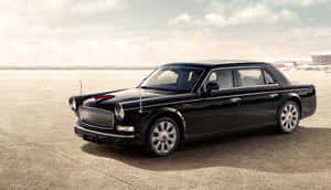 Sleek Hongqi Luxury Car On A Desert Road Wallpaper