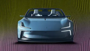 Sleek Hybrid Car On Road Wallpaper