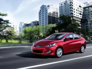 Sleek Hyundai Accent In A Beautiful Nature Setting Wallpaper