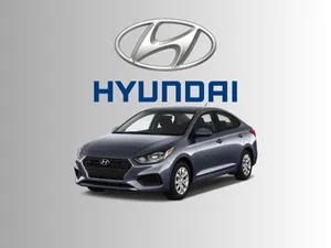 Sleek Hyundai Accent In A Picturesque Landscape Wallpaper