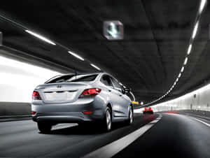 Sleek Hyundai Accent On The Road Wallpaper