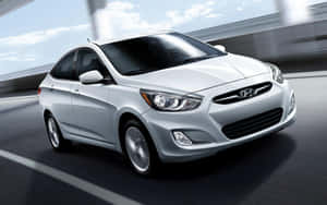 Sleek Hyundai Accent On The Road Wallpaper