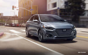 Sleek Hyundai Accent Parked In Elegance Wallpaper