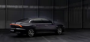 Sleek Hyundai Azera In Motion On A Scenic Road Wallpaper