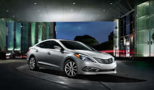 Sleek Hyundai Azera In Motion On Urban Roads Wallpaper