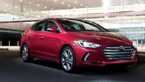 Sleek Hyundai Elantra In Vibrant City Setting Wallpaper