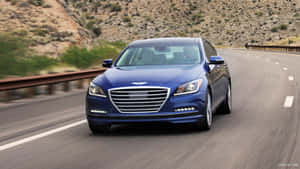 Sleek Hyundai Genesis Cruising The Road Wallpaper