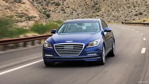 Sleek Hyundai Genesis Cruising The Road Wallpaper