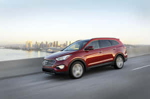 Sleek Hyundai Santa Fe On A Scenic Road Trip Wallpaper