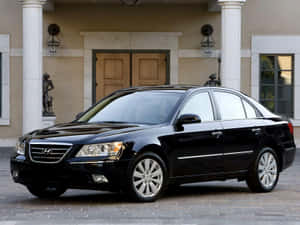 Sleek Hyundai Sonata On A Scenic Road Wallpaper