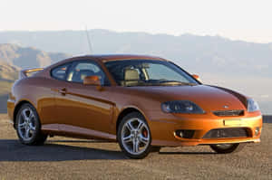 Sleek Hyundai Tiburon At Dusk Wallpaper