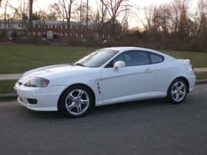 Sleek Hyundai Tiburon In A Stunning Landscape Wallpaper