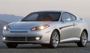 Sleek Hyundai Tiburon In Motion Wallpaper